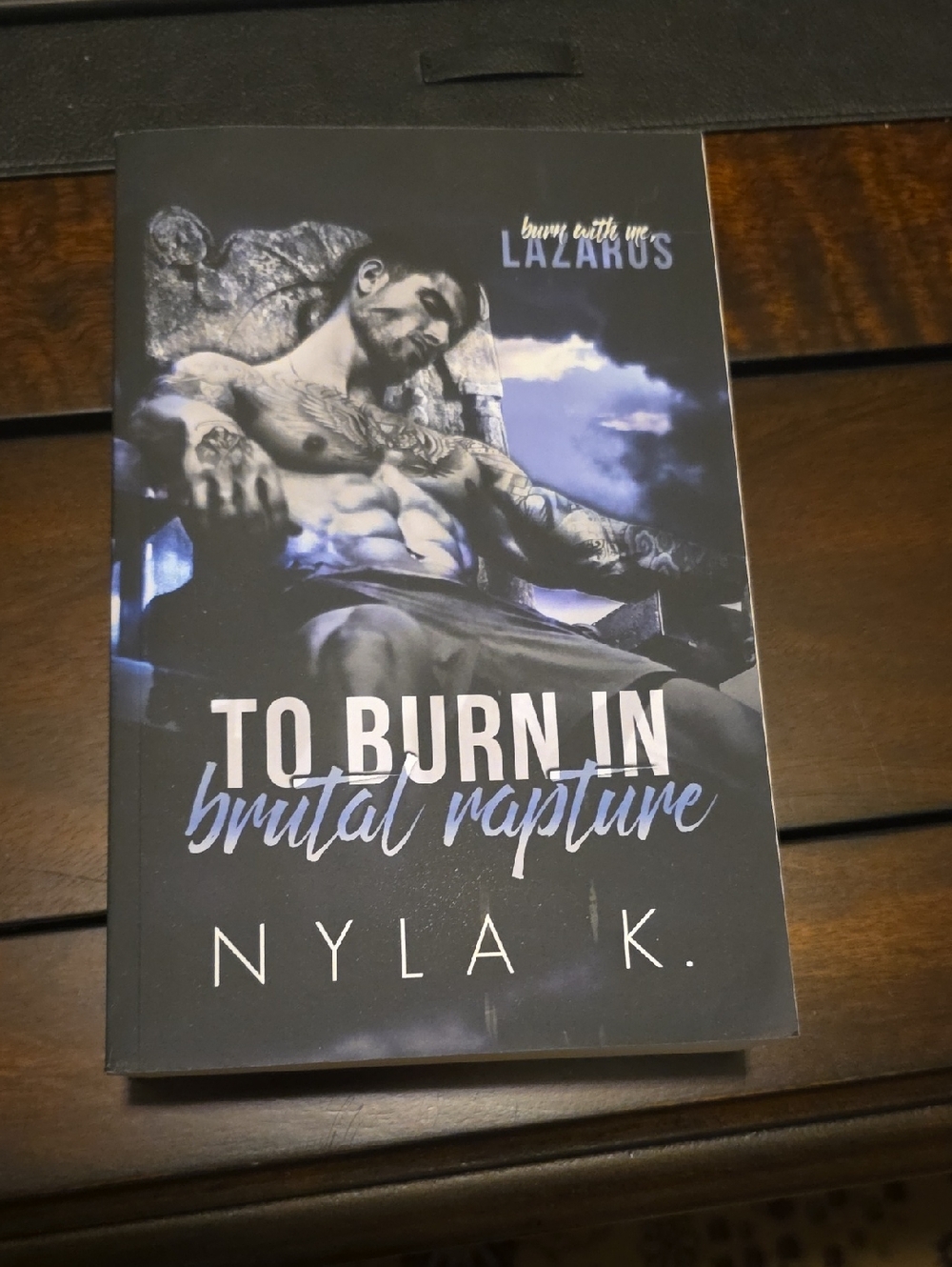 To Burn In Brutal Rapture by Nyla K. - Black & Blue Cover Paperback